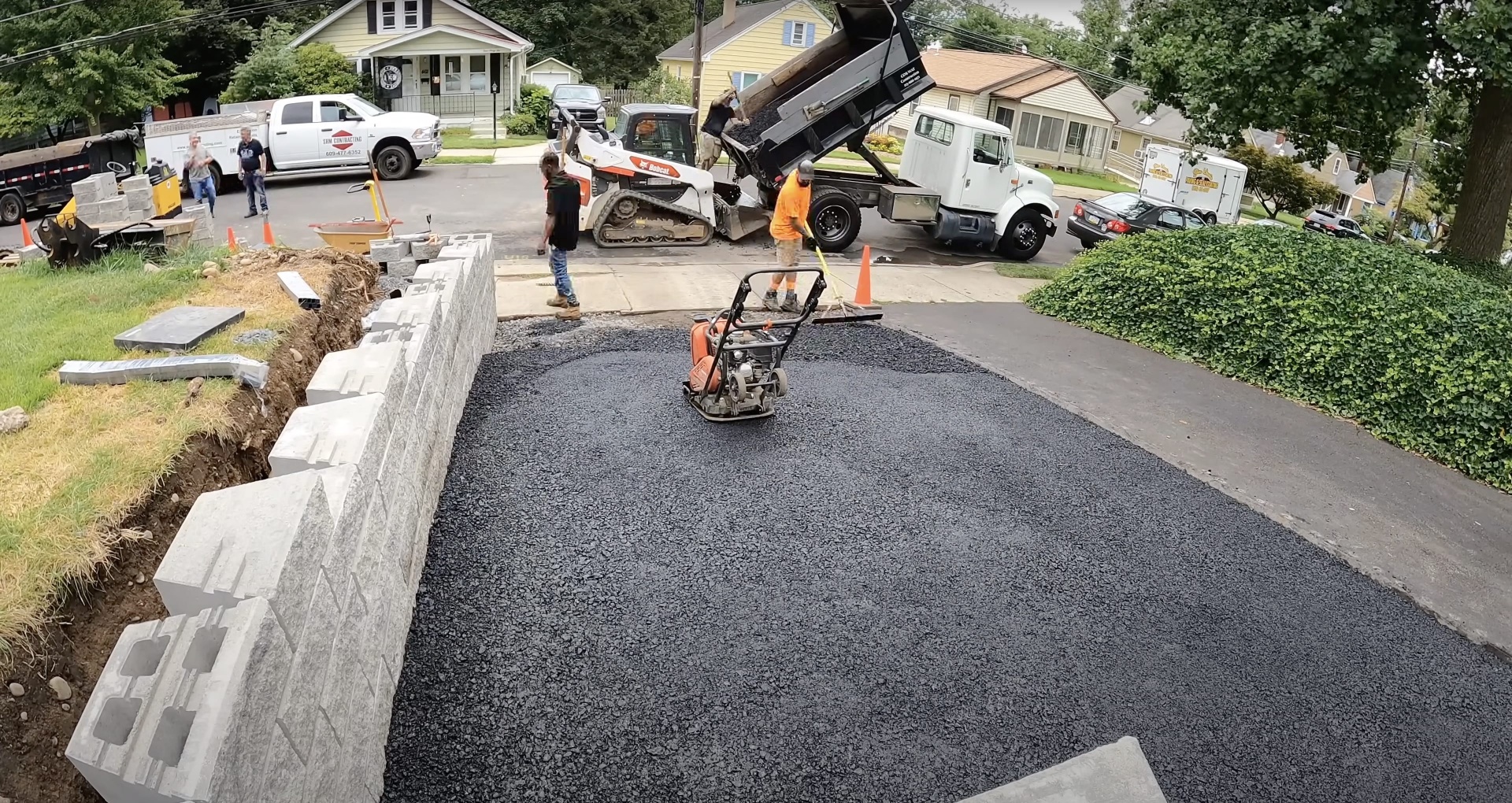 Salem Concrete Contractor professional team at work Professional concrete construction crew working on asphalt and concrete installation project