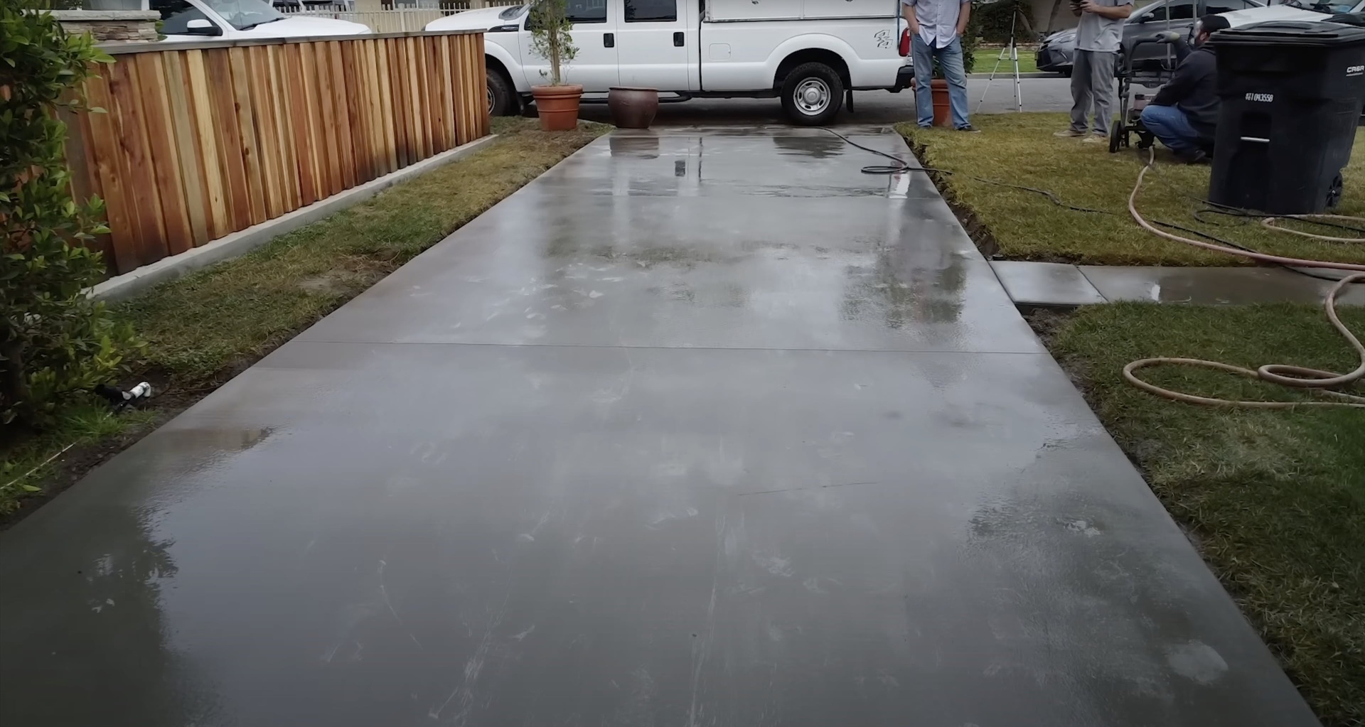 Fresh Concrete Driveway Installation Fresh concrete driveway installation with smooth finish and proper curing process