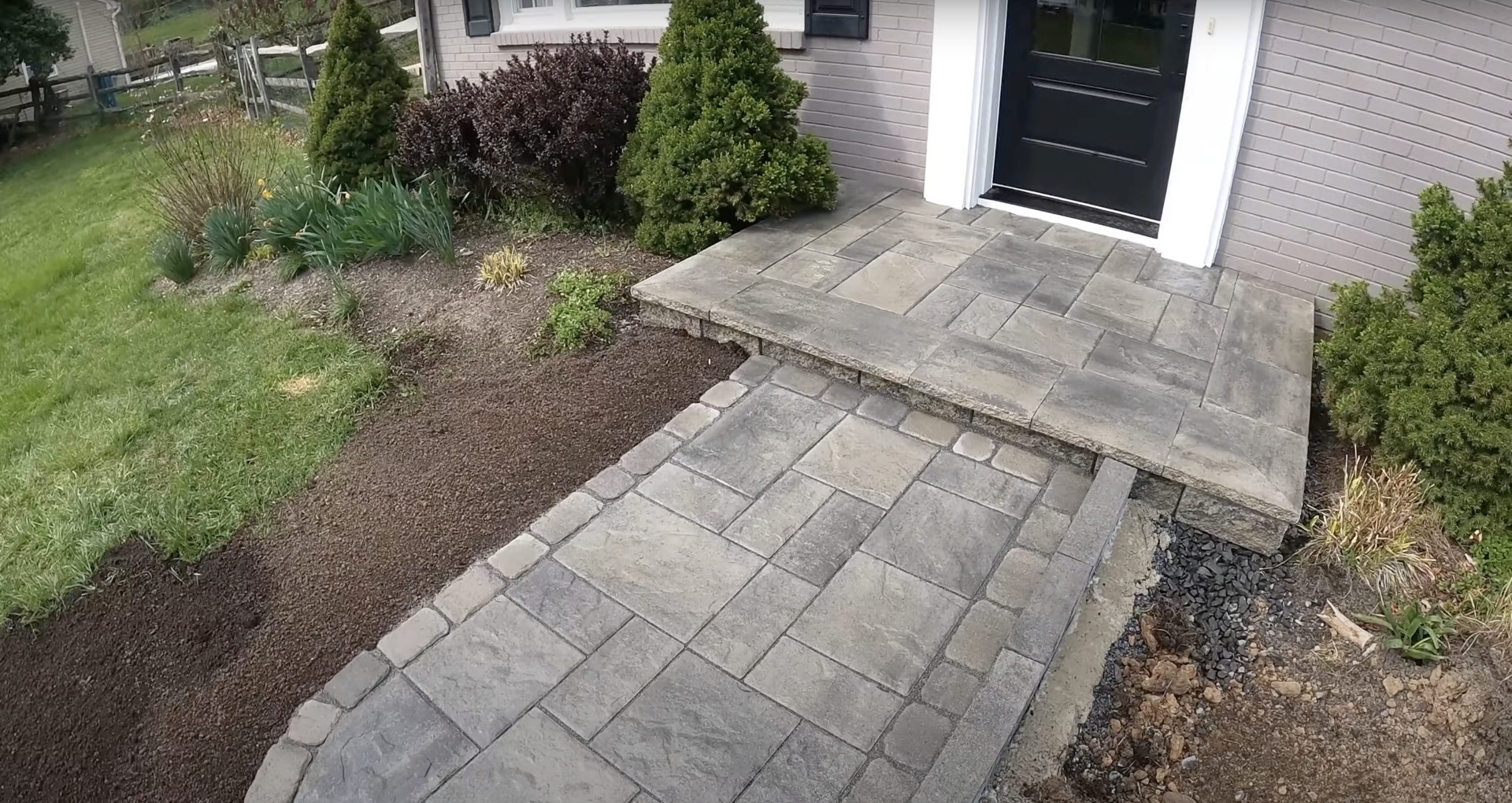 Decorative Concrete Walkway and Steps Custom concrete walkway and entrance steps with decorative stamped pattern design