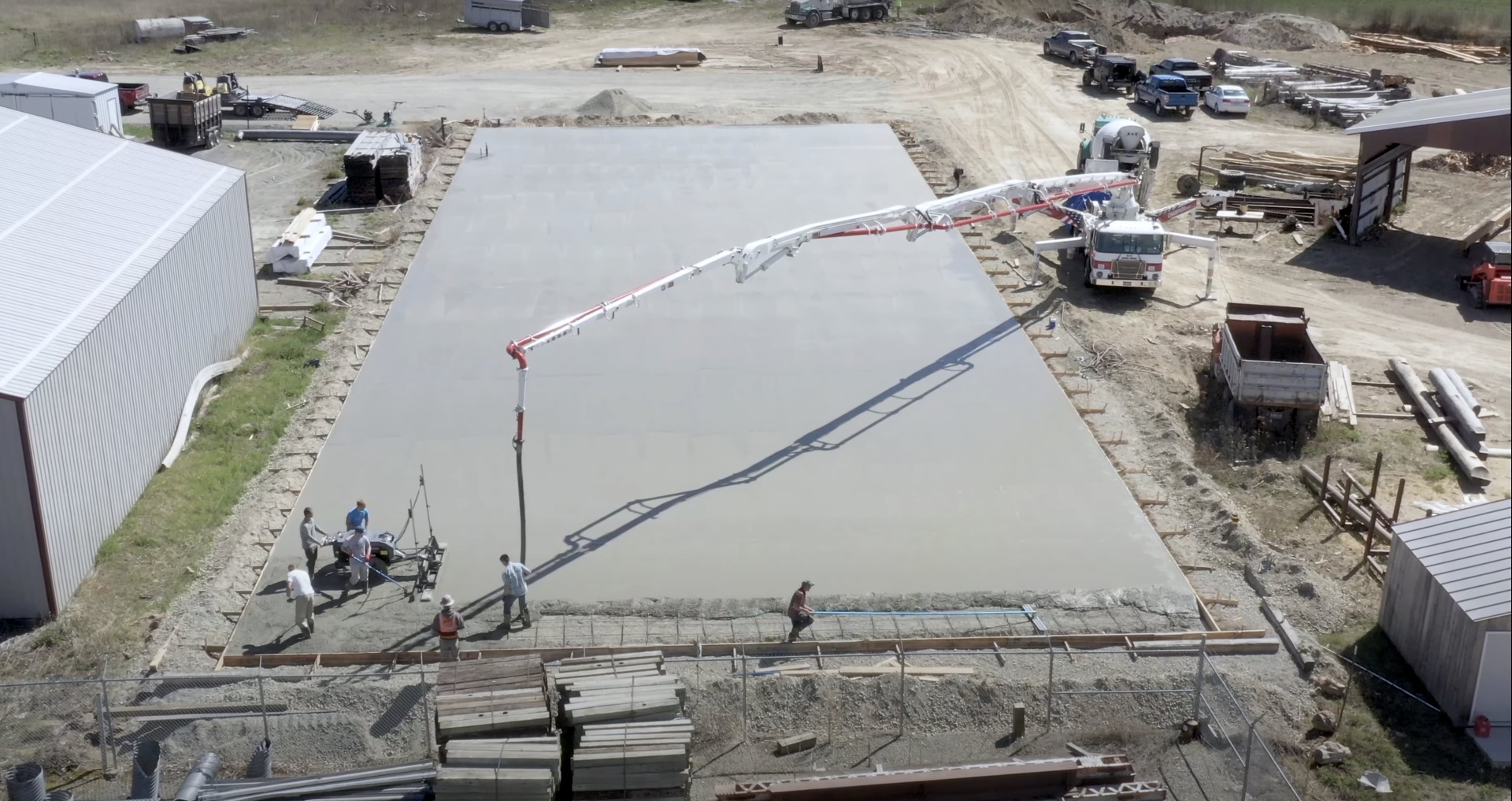 Commercial Concrete Slab Installation Large-scale commercial concrete slab pour using professional equipment and techniques